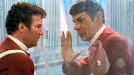 Kirk and Spock separated by glass and Spock gives him the vulcan salute in 'Wrath of Khan'