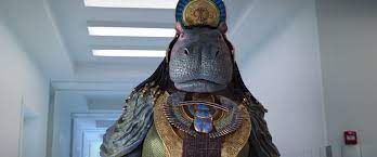 Taweret, an Egyptian goddess with a hippo's head, stands in a hallway.