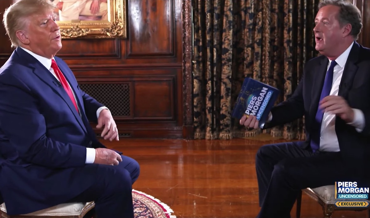 Piers Morgan interviews Donald Trump as they both look upset.