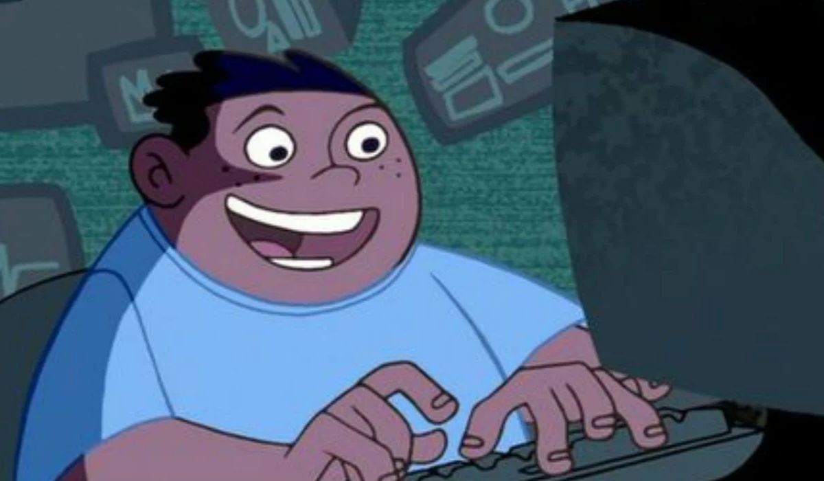 Tech wiz Wade from Kim Possible franchise click clacking away on a computer. Image: Disney.