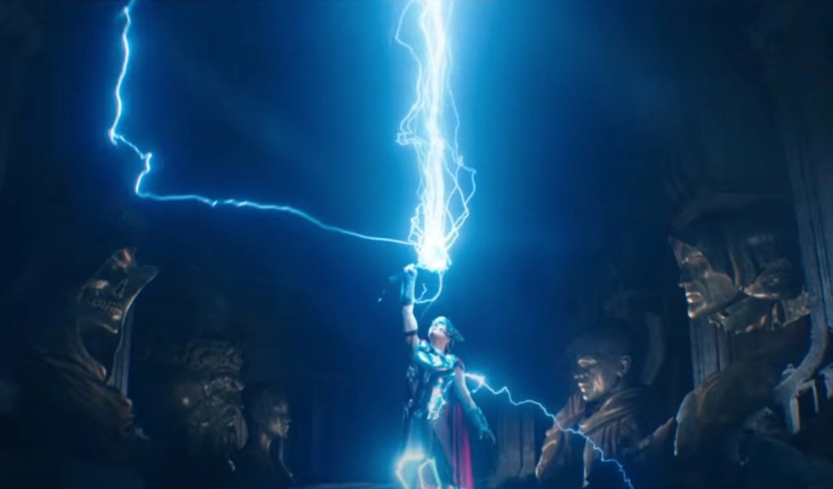 Jane, as the Mighty Thor, summons lightning with Mjolnir.
