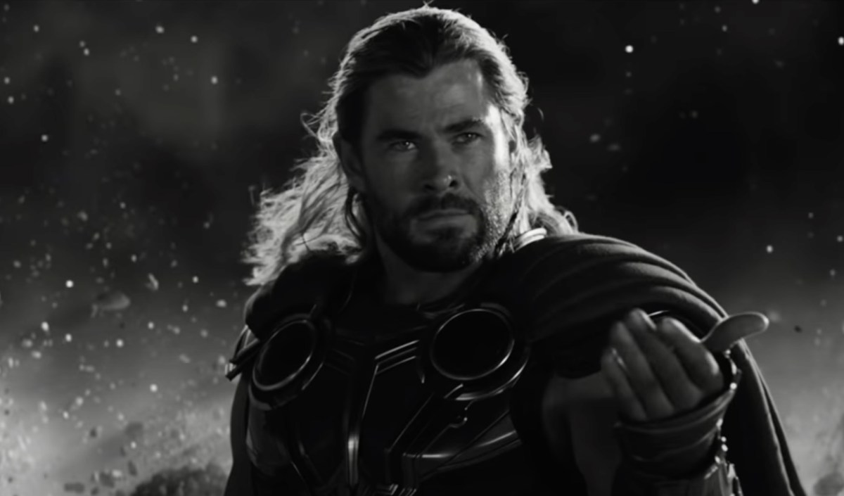 Thor stands in a battle stance, beckoning his enemy to attack.