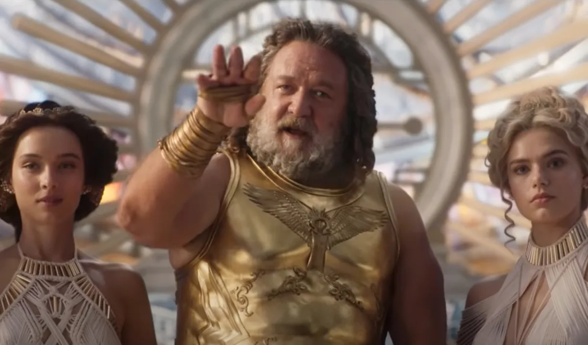 Russell Crowe as Zeus in Thor 4, with a young woman on each side of him.