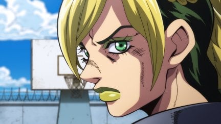 Jolyne standing in the yard of the prison