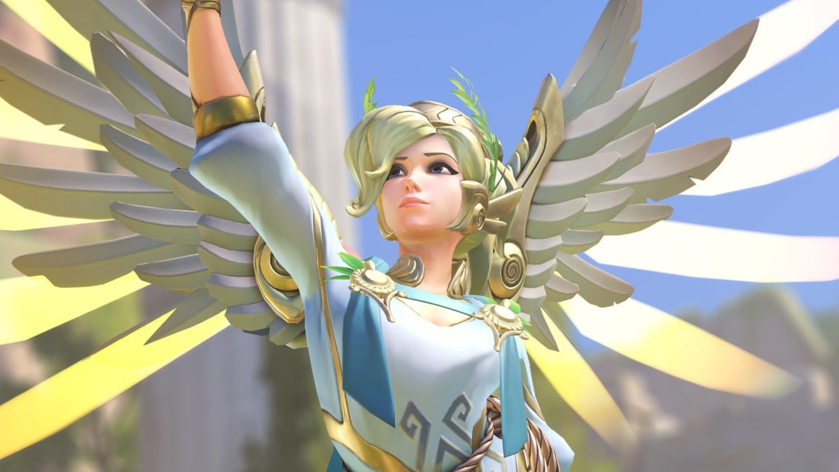 Mercy stands triumphantly like a Greek goddess.