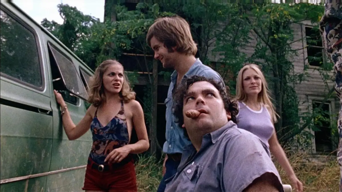 The gang stands next to a van in Texas Chainsaw Massacre.