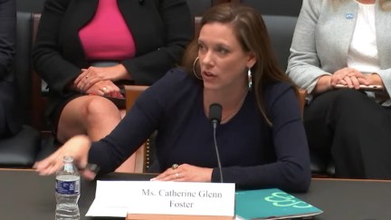 A white woman testifies before congress, looking irritated