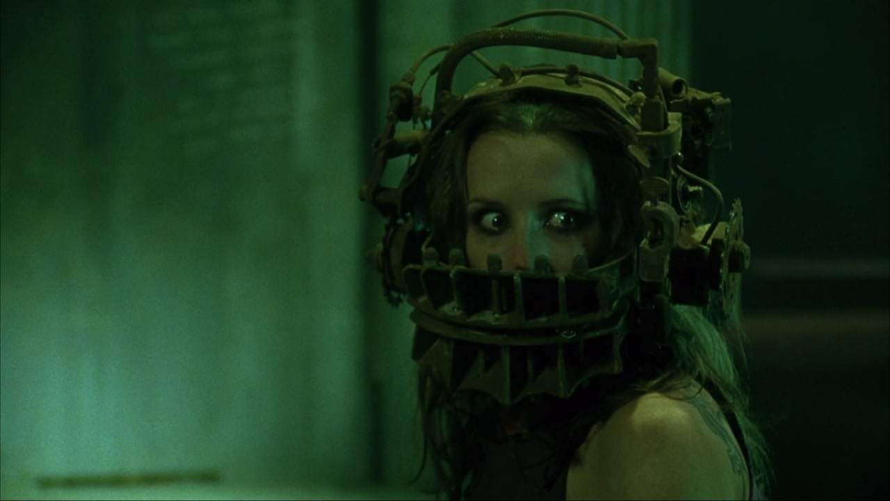 Amanda wearing the reverse bear trap in Saw (2004)