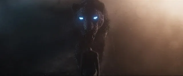 Large Black cat with glowing eyes in Black Panther (2018.) Image: Marvel Entertainment.