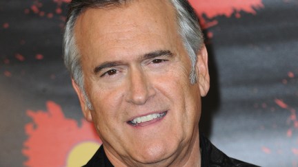 Bruce Campbell smiles at the camera.