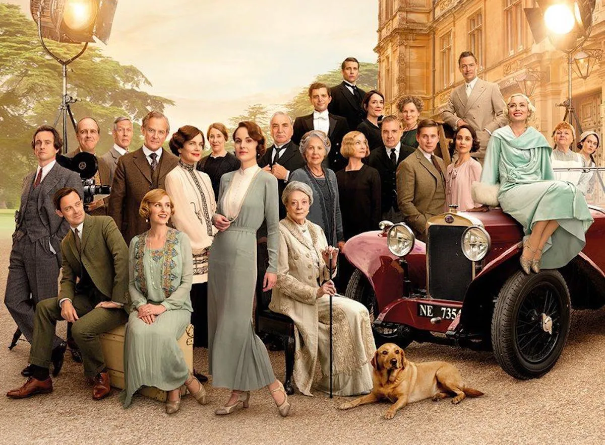 Downton Abbey: A New Era poster with all the cast in front of the abbey.