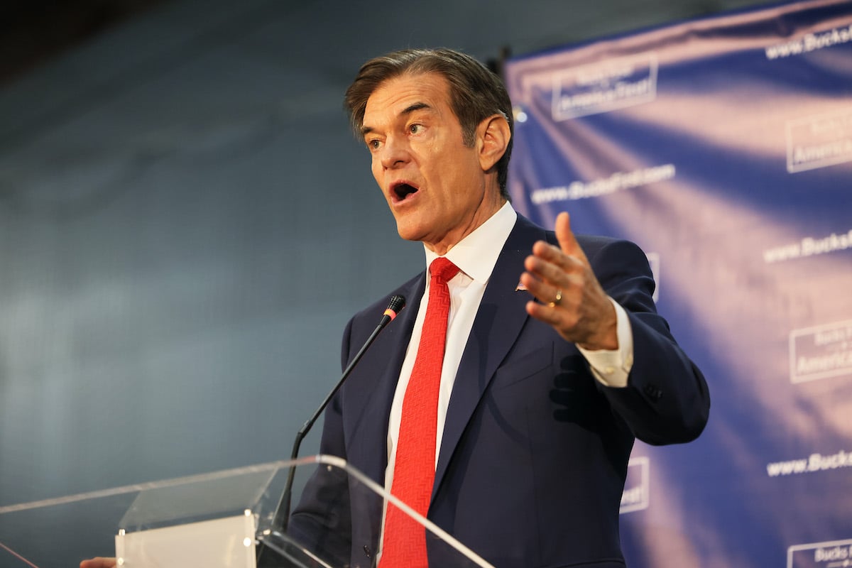 Dr. Oz speaks and gestures at a podium