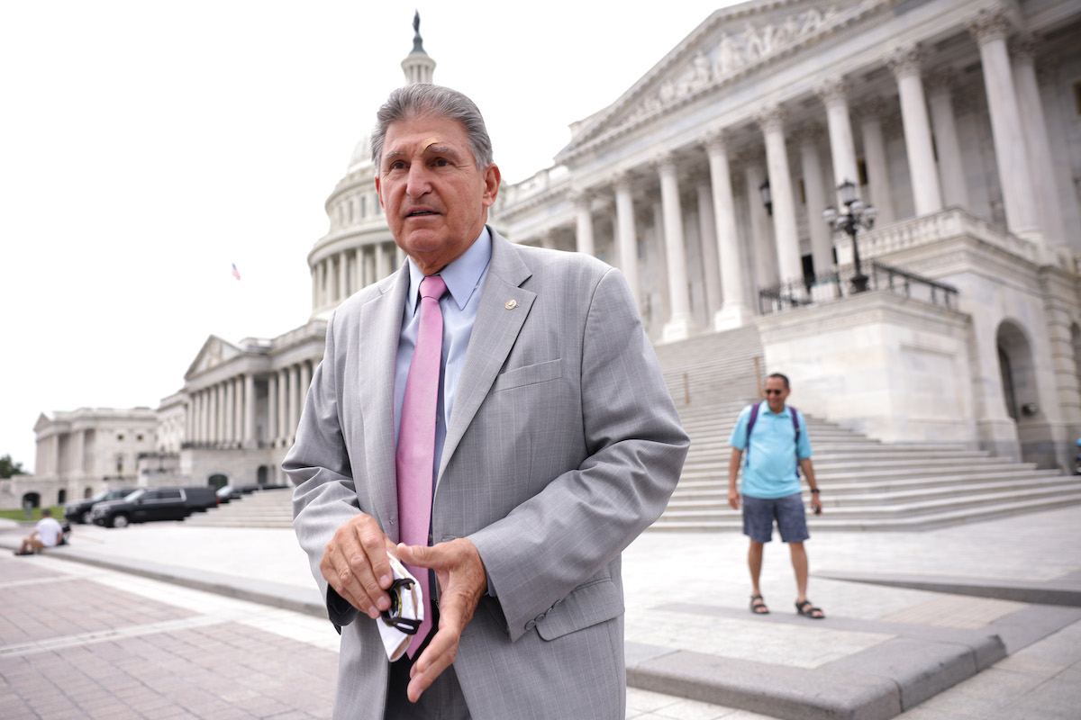 Joe Manchin stops to speak outside of the US Capitol