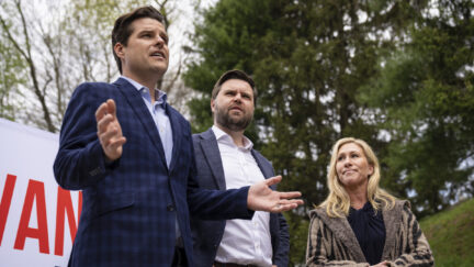Matt Gaetz speaks at an outdoor rally standign next to JD Vance and Marjorie Taylor Greene