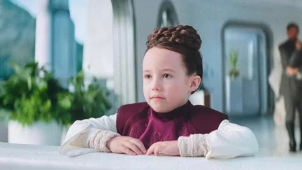 Vivien Lyra Blair as young Leia in Obi-Wan Kenobi, sitting at a table.