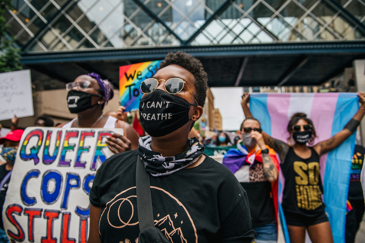 Black demonstrators march in the streets during a Pride rally