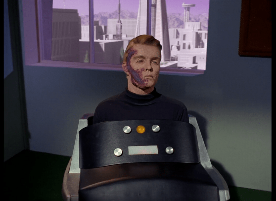 Captain Pike, wounded, in his medical chair