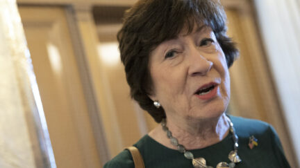 Susan Collins speaks in a Capitol hallway.