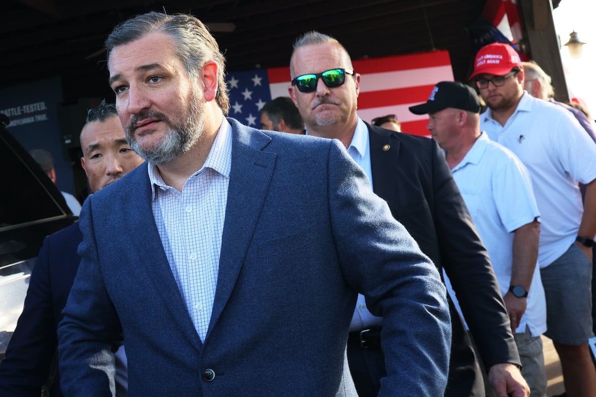 Ted Cruz leaves a Republican campaign event outdoors