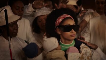 Amandla Stenberg blind and holding serval babies in the fictional movie 