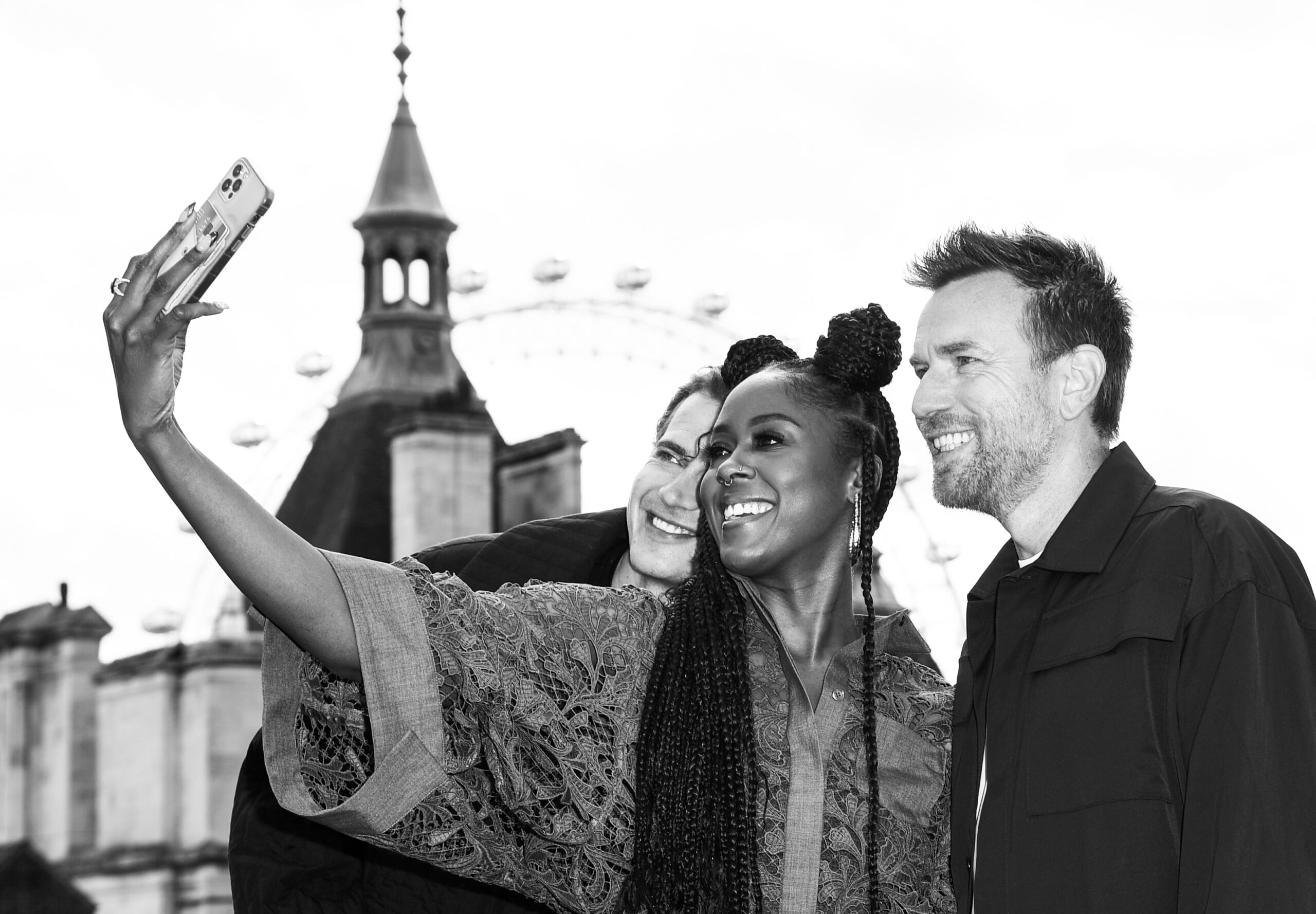 Moses Ingram, Hayden Christensen, and Ewan McGregor taking a selfie
