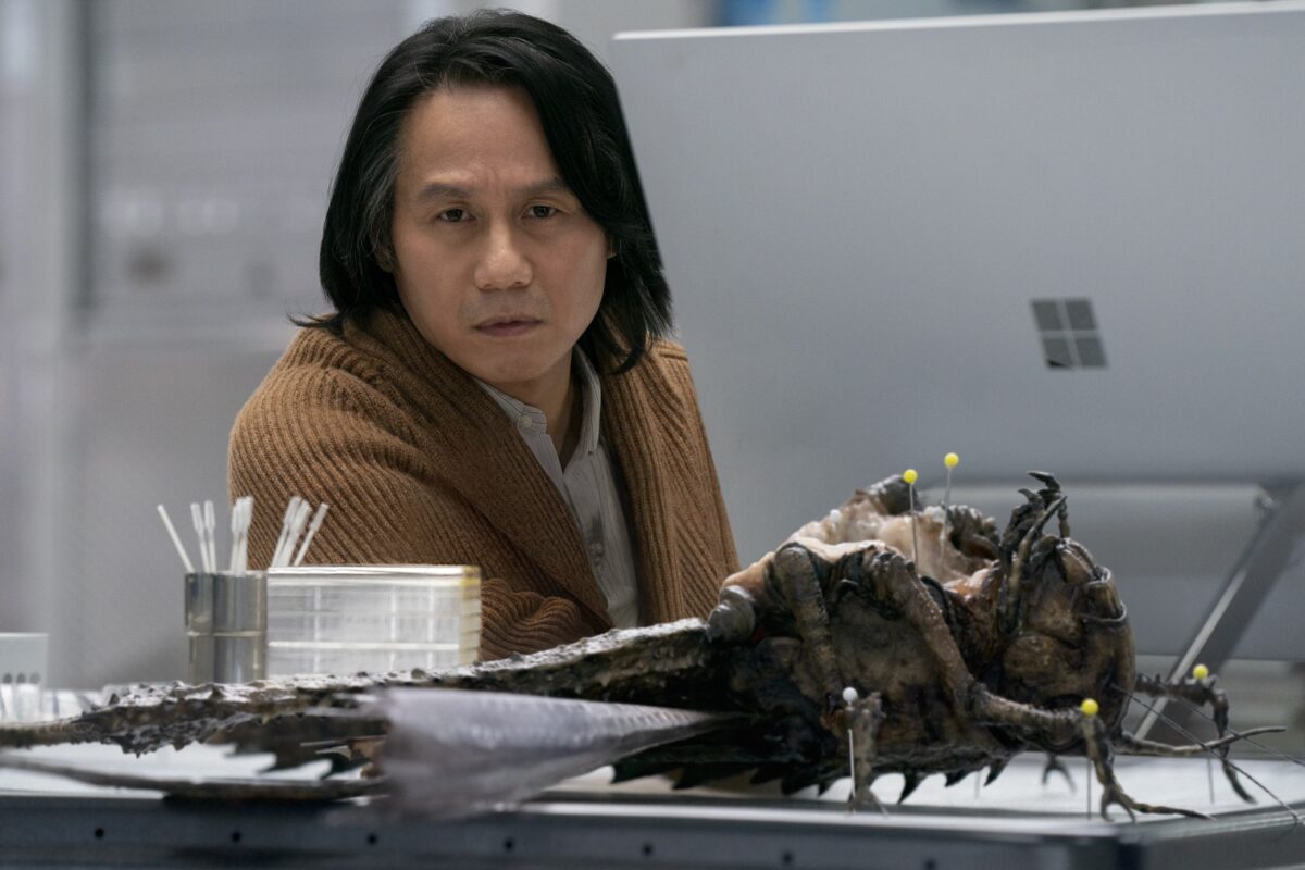 Doctor Henry Wu questioning his life choices as he stares at a dissected giant locust he helped create.