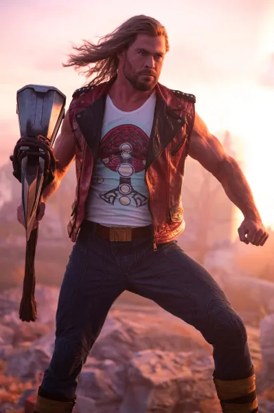 Chris Hemsworth poses as Thor, holding Stormbreaker.