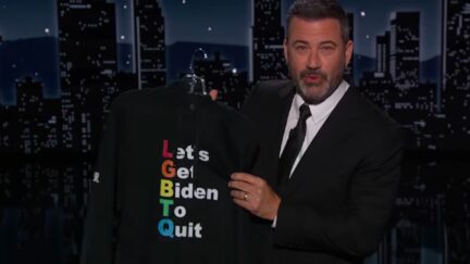Jimmy Kimmel holds up a black hoodie with LGBTQ in rainbow letters, serving as an acrostic for 