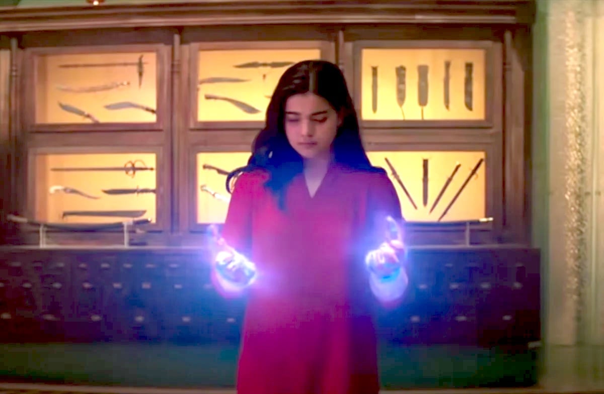 Kamala Khan looks at her glowing hands in Ms. Marvel.