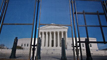 U.S. Supreme Court behind a high fence.