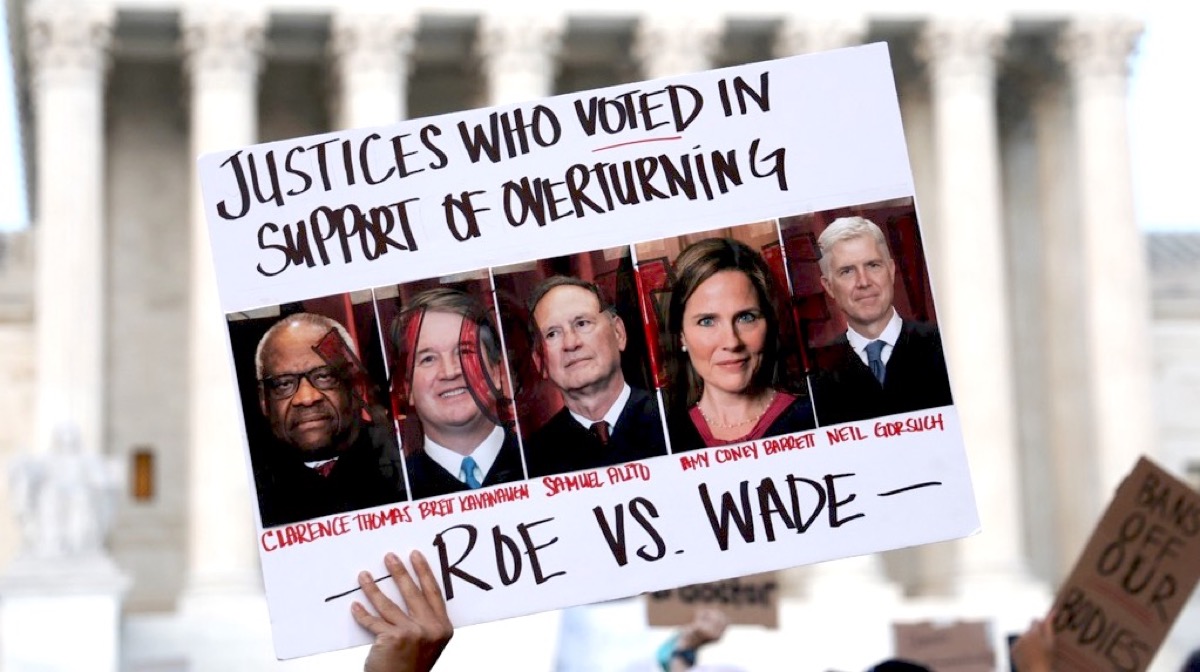 WASHINGTON, DC - MAY 03: A pro-choice activist holds up a sign during a rally in front of the U.S. Supreme Court in response to the leaked Supreme Court draft decision to overturn Roe v. Wade May 3, 2022 in Washington, DC. In a leaked initial draft majority opinion obtained by Politico and authenticated by Chief Justice John Roberts, Supreme Court Justice Samuel Alito wrote that the cases Roe v. Wade and Planned Parenthood of Southeastern Pennsylvania v. Casey should be overturned, which would end federal protection of abortion rights across the country. (Photo by Alex Wong/Getty Images)