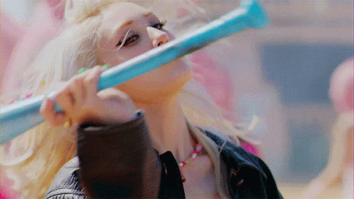 A gif of K-Pop soloist Somi from the music video of her single "XOXO"