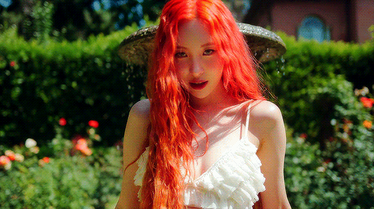 A gif of Sunmi from the music video of her most recent release "Heart Burn"