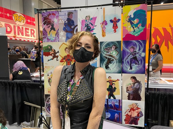 Artist Briana Garcia poses at her booth at SDCC 2022.