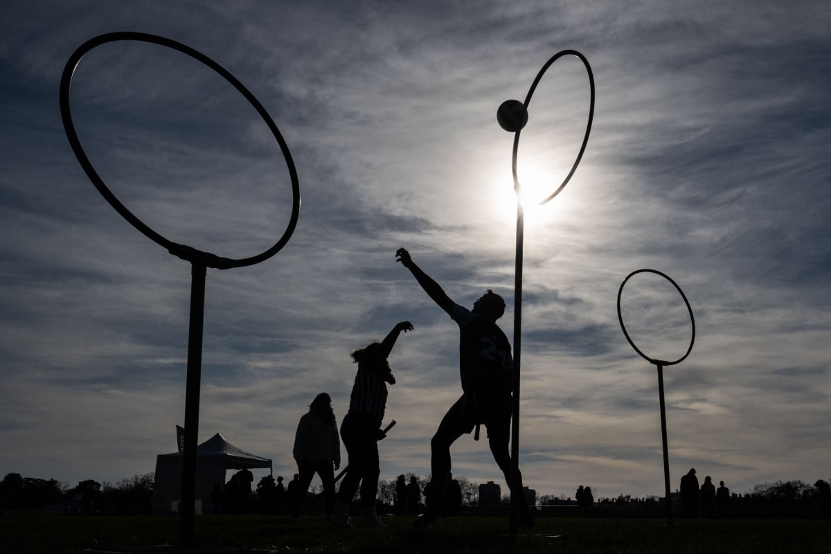 People play quidditch, a sport inspired by the "Harry Potter" literary books, in the sidelines of a French championships match, in Nantes, western France, on February 12, 2022. (Photo by LOIC VENANCE / AFP) (Photo by LOIC VENANCE/AFP via Getty Images)