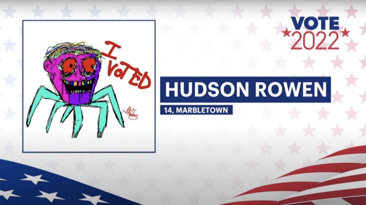 Hudson Rowan's "I Voted" sticker design submission with a frightening human head on a set of spider legs.