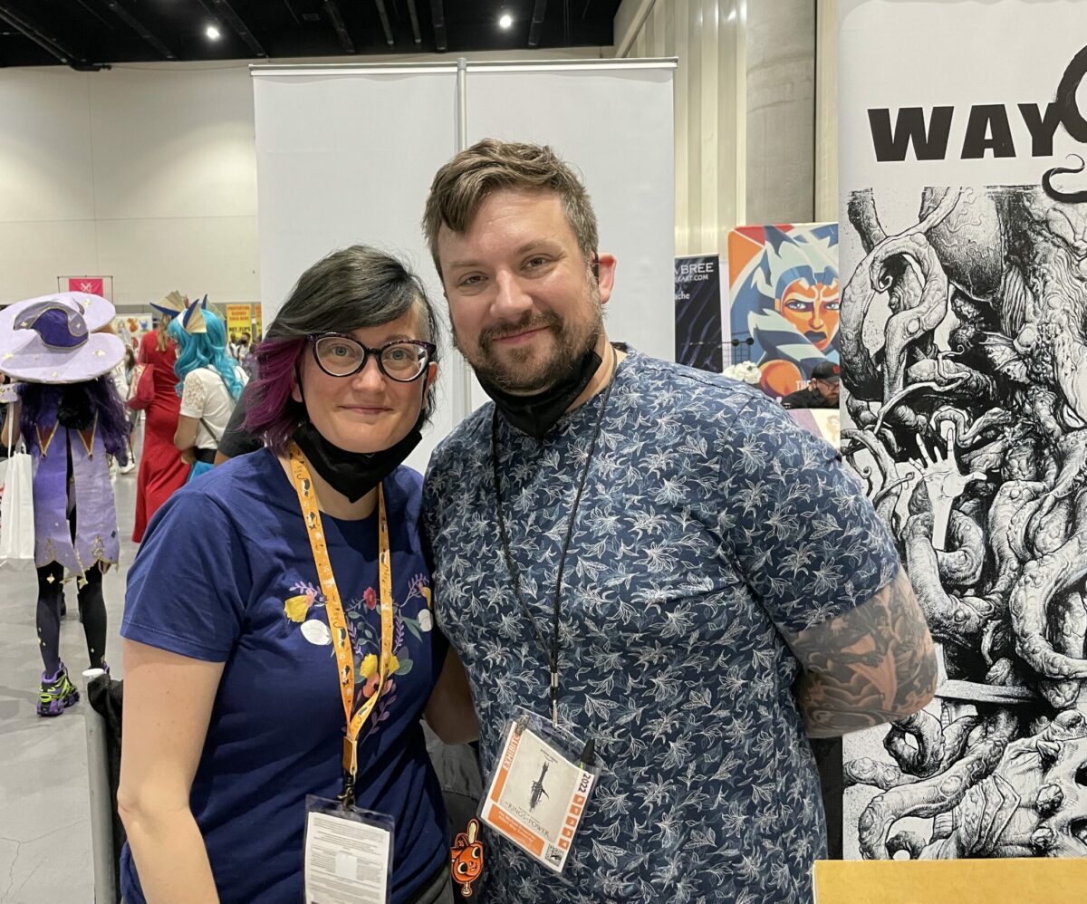 Artist Joseph Michael poses with his partner at SDCC 2022.