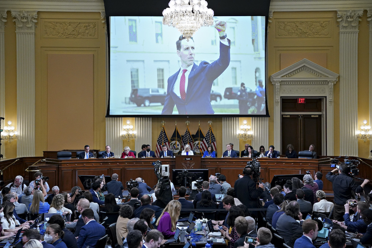 A photograph of Senator Josh Hawley (R-MO) is displayed on a screen during a hearing of the Select Committee