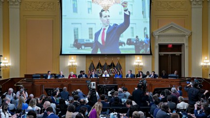 A photograph of Senator Josh Hawley (R-MO) is displayed on a screen during a hearing of the Select Committee