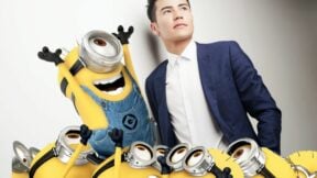 Young man in suit next to a bunch of minions. Image: Illumination and Royal Anwar via Pexels. https://www.pexels.com/photo/man-wearing-blue-blazer-and-white-dress-shirt-leaning-on-white-wall-450212/