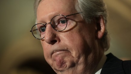 A closeup of Mitch McConnell frowning.