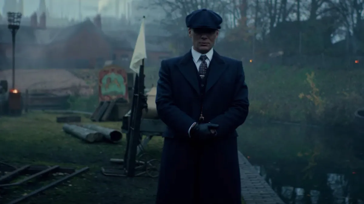 Tommy Shelby in front of a war zone in Peaky Blinders