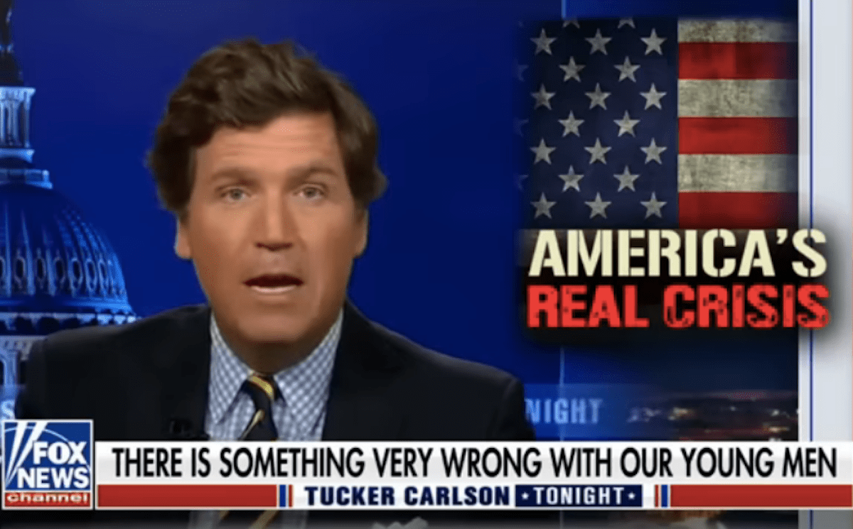 Tucker Carlson on his show, gape-mouthed, next to a graphic reading "America's real crisis"