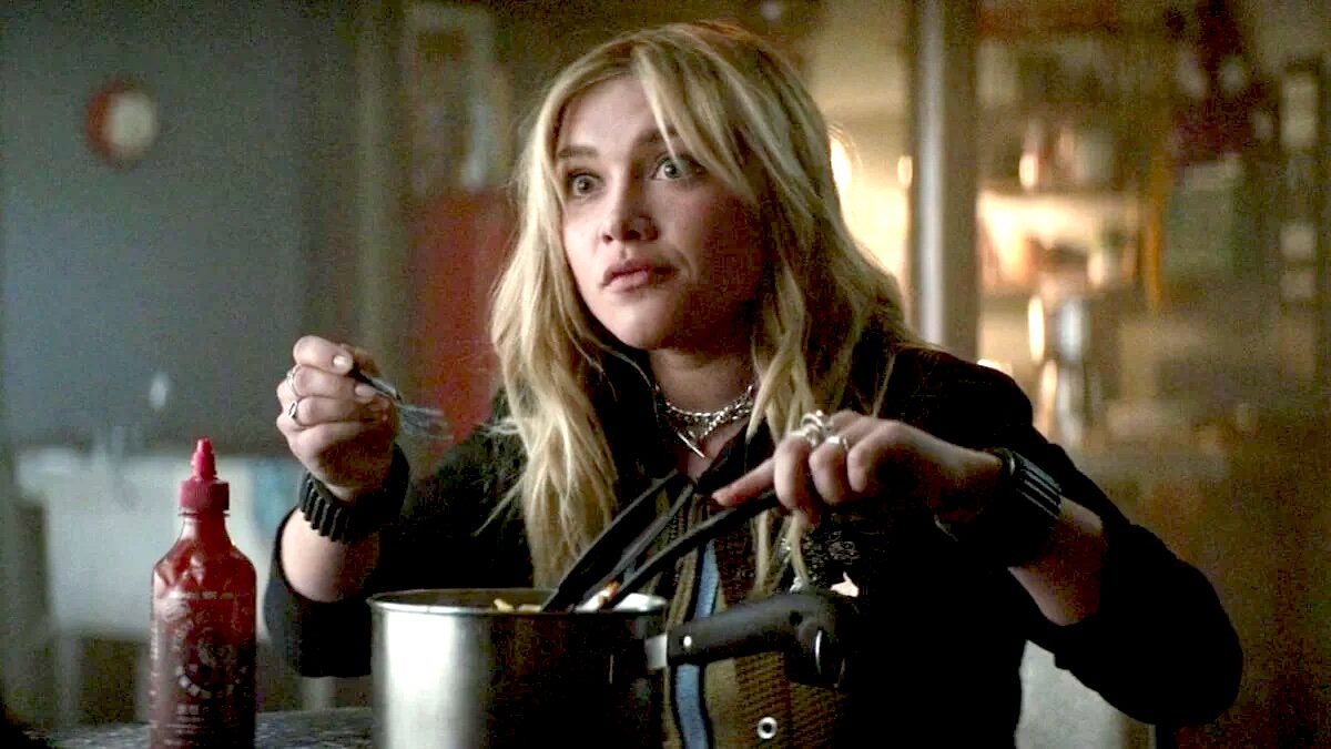 Marvel's Yelena Belova looking up from a cooking pot, surprised.