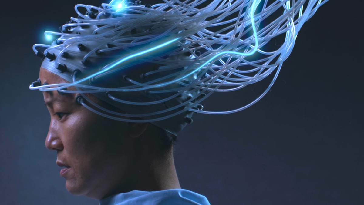 Film still from Advantageous featuring Jacqueline Kim as Gwen with a complex system of wires attached to her head