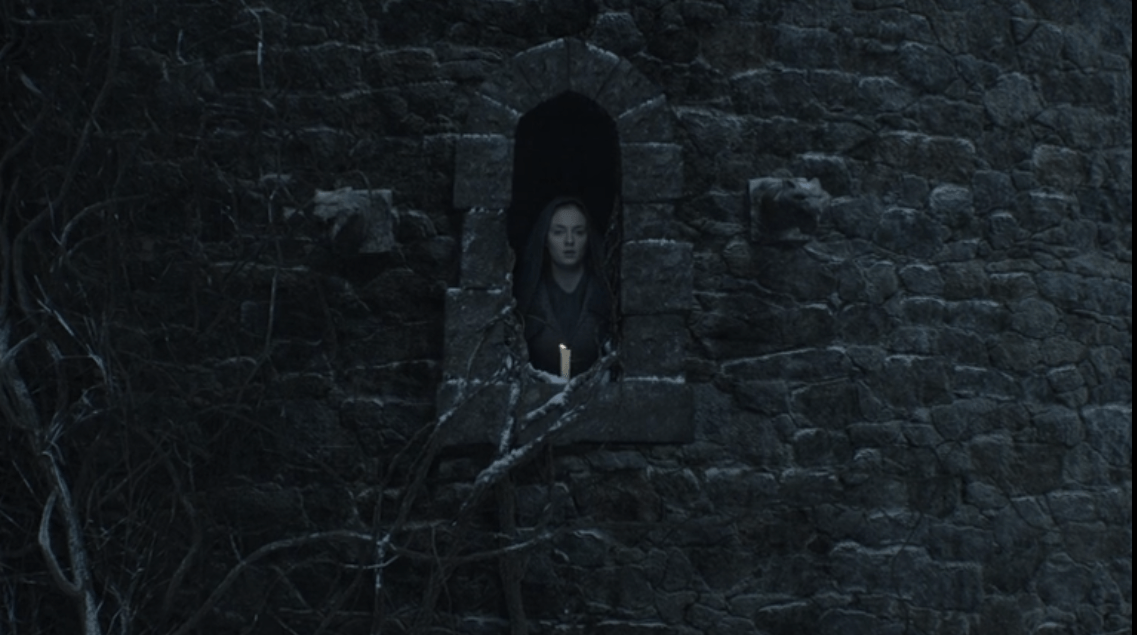 Sansa Stark, played by Sophie Turner, lights a candle in the Broken Tower at Winterfell in Season 5 of Game of Thrones