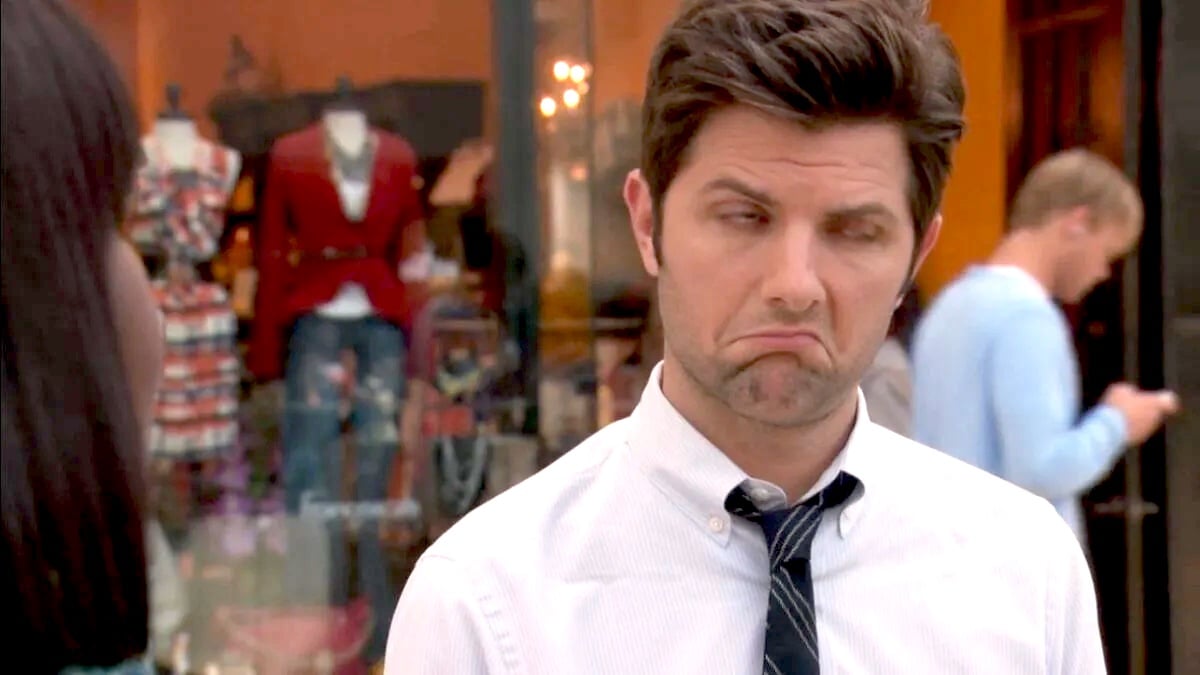 Adam Scott making a disgruntled face in parks and Recreation.