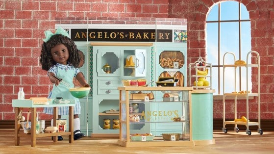 Claudie (doll) hanging out in her father's bakery. Image: American Girl.