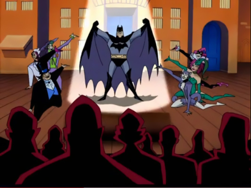 Batman the Musical with Joker, Two-Face, Penguin, Hawley Quinn, Poison Ivy, and Catwoman flanking Batman