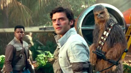 Poe Dameron, Finn, and Chewbacca standing outside a ship in a jungle in Star Wars: The Rise of Skywalker trailer.